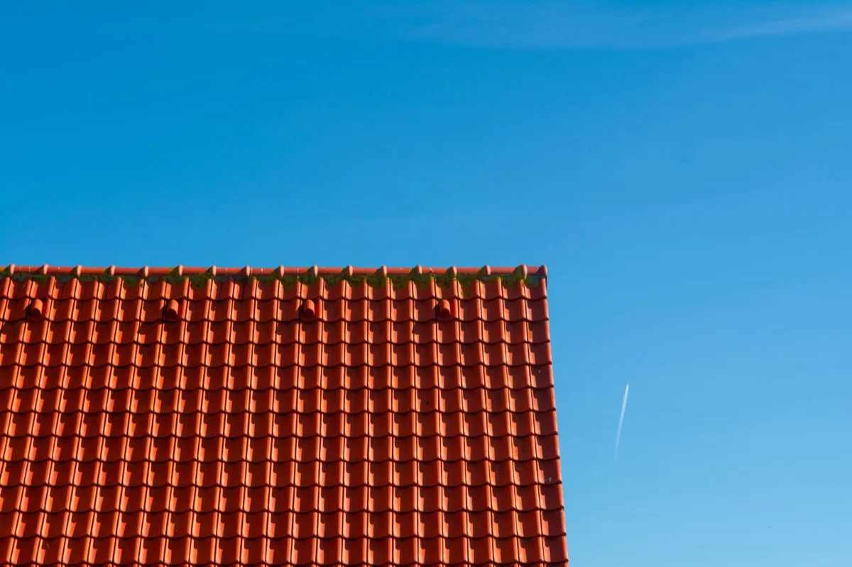 Tile roof gable in full sun, the kind of exposure that sets roof life in Warner Robins, GA